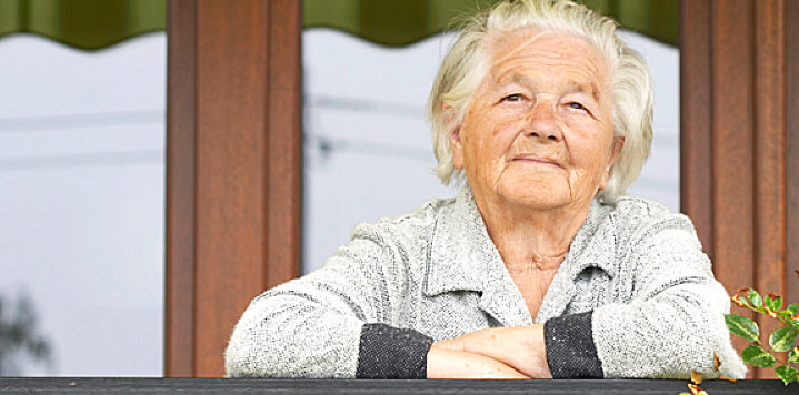 woman on a wheelchair smiling at her husband