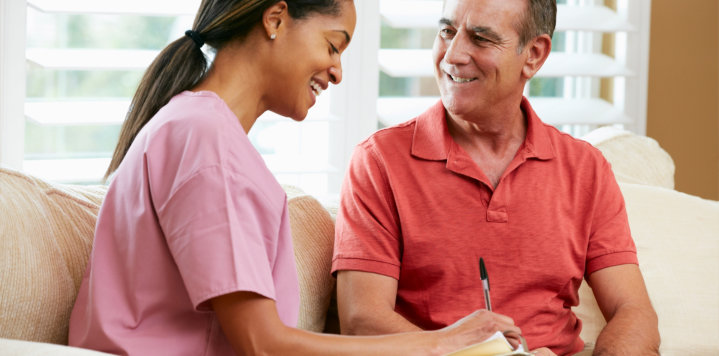 woman talking to an elderly man