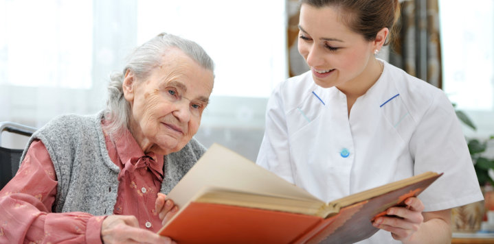 elderly woman and a young caregiver