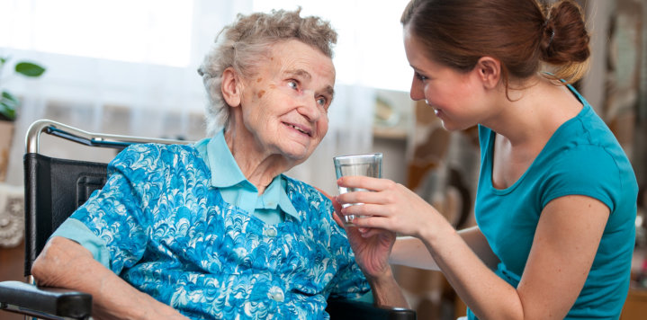 elderly woman and her caregiver