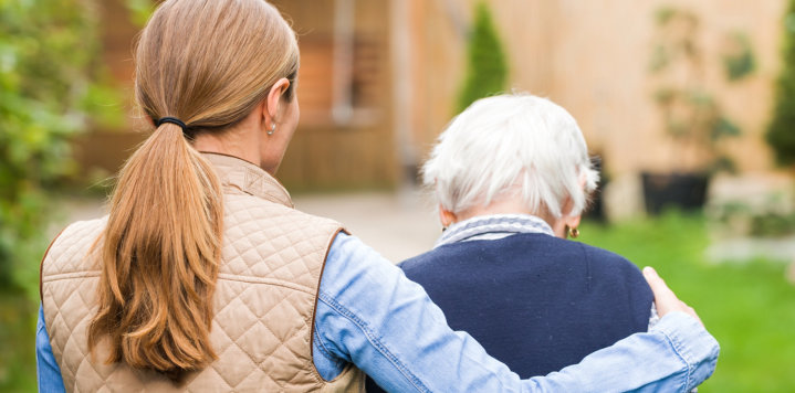 woman assists the elderly woman